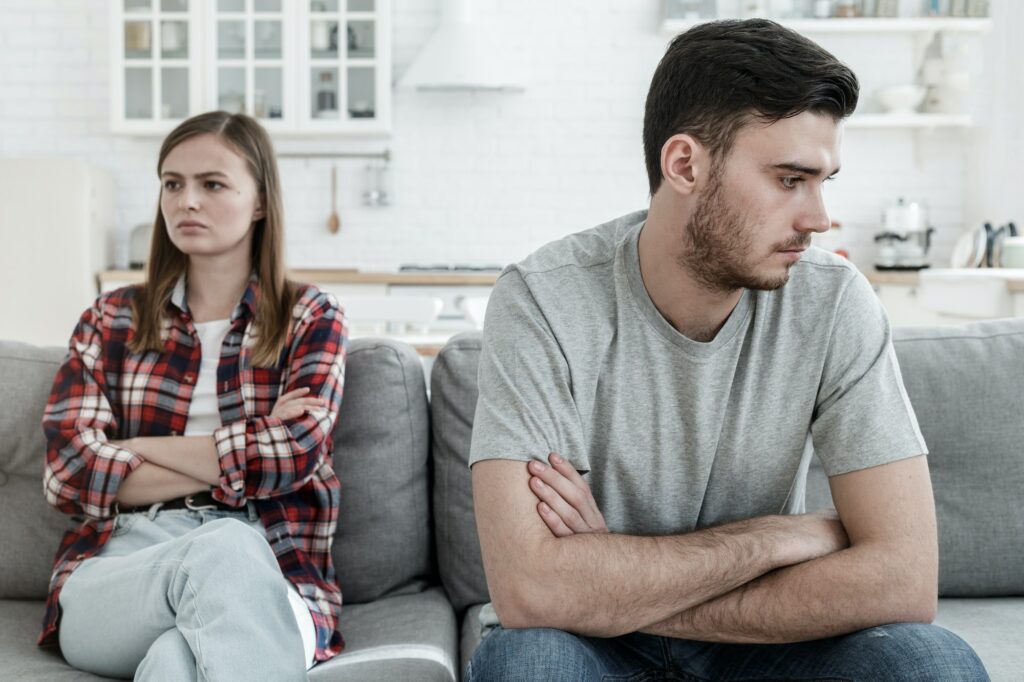 European couple spends time not eager to talk with each other after breakdown
