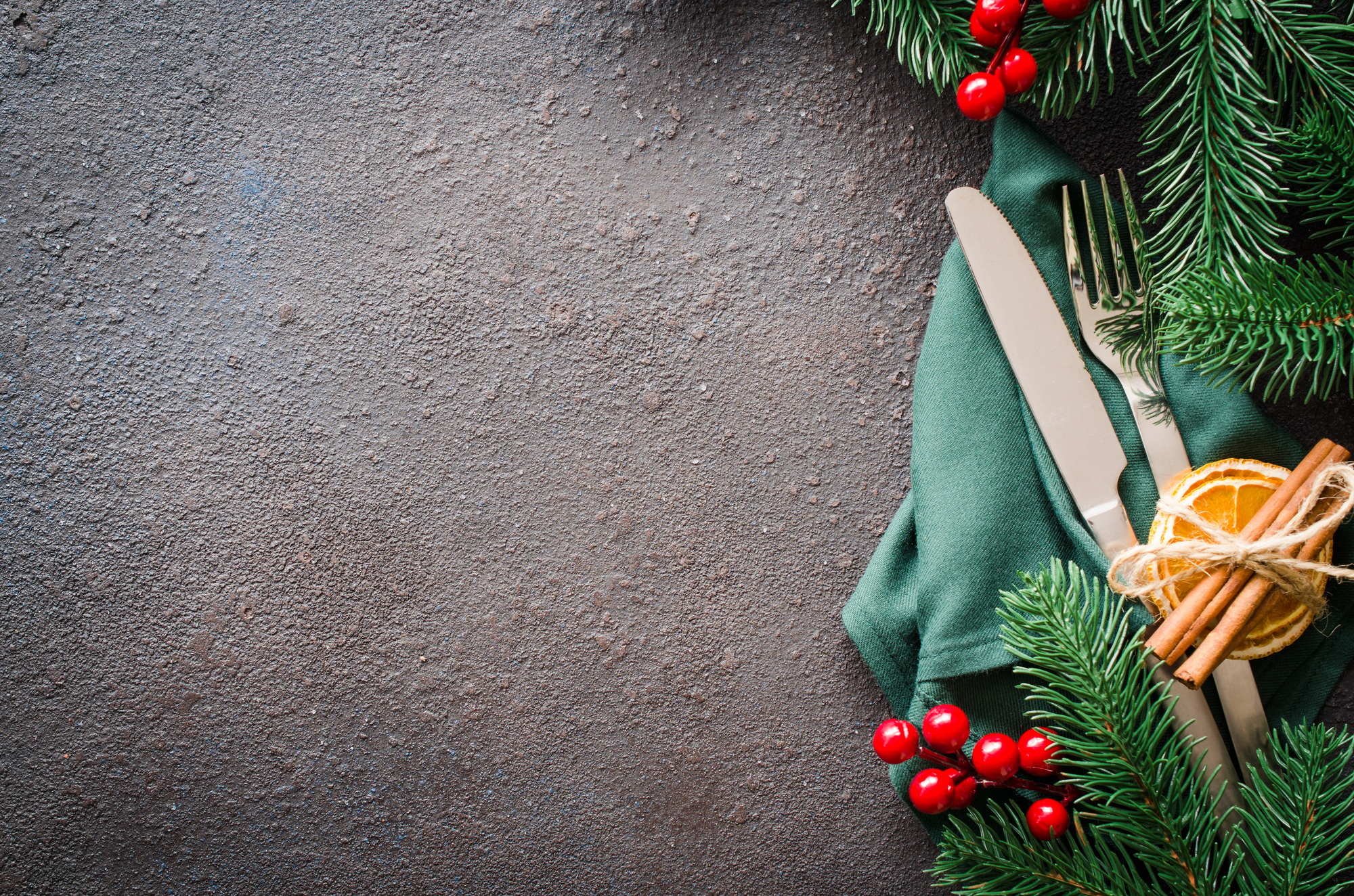 Christmas festive table setting with xmas decorations for christmas or new year dinner.